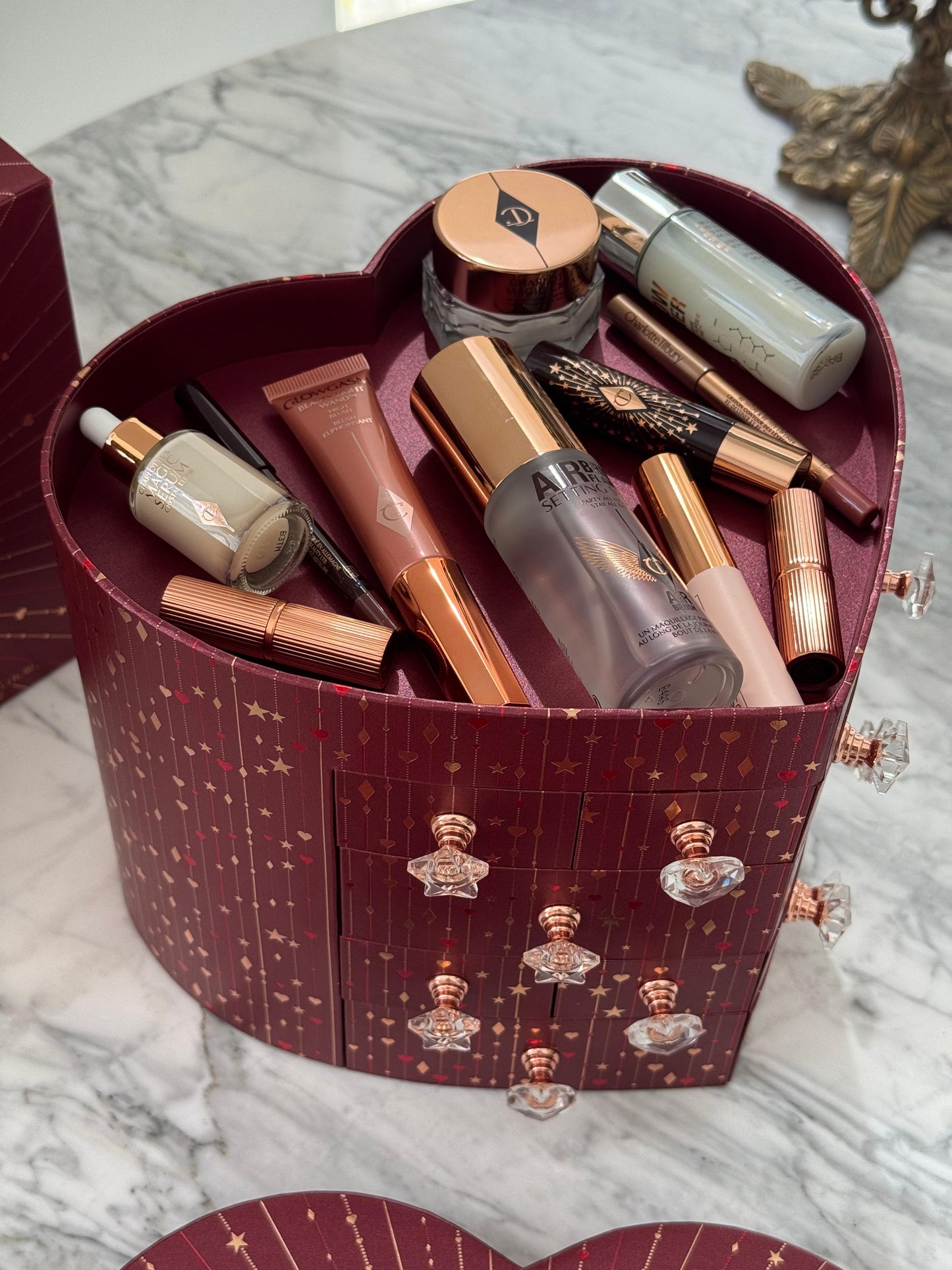 CHARLOTTE TILBURY’S Beauty Treasure Chest Of Love Set
12 Door Beauty Advent Calendar