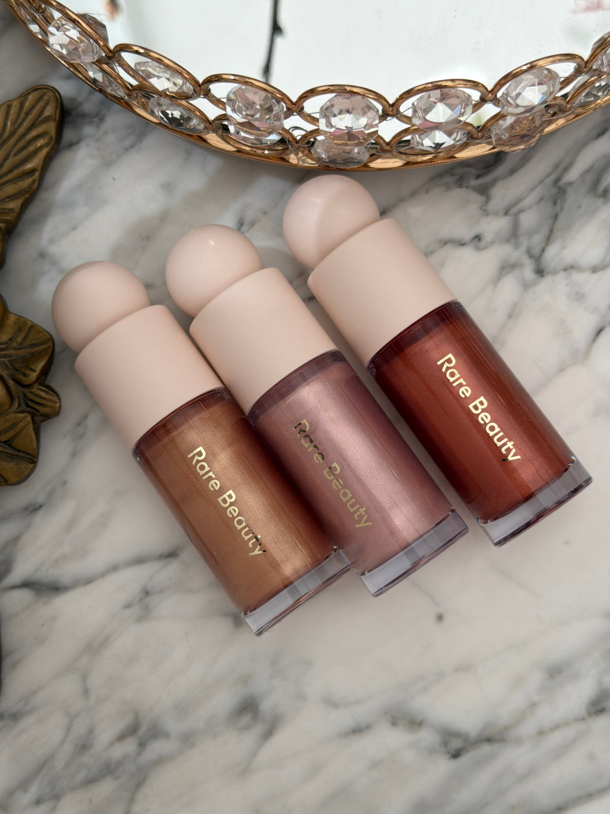 RARE BEAUTY Positive Light Liquid Luminizer - Enchant