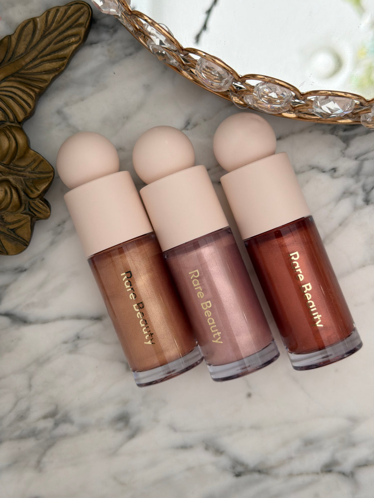 RARE BEAUTY Positive Light Liquid Luminizer - Captivate