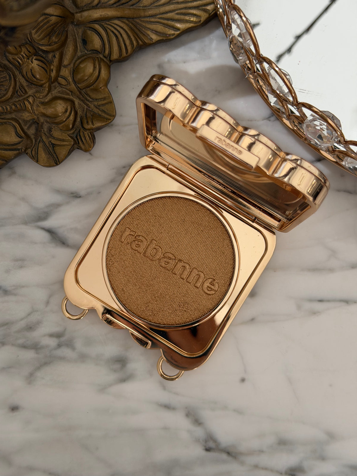 PACO RABANNE 1969 Makeup Clutch
Ultra-Shiny, All-Over Luminizer, Second Skin Comfort