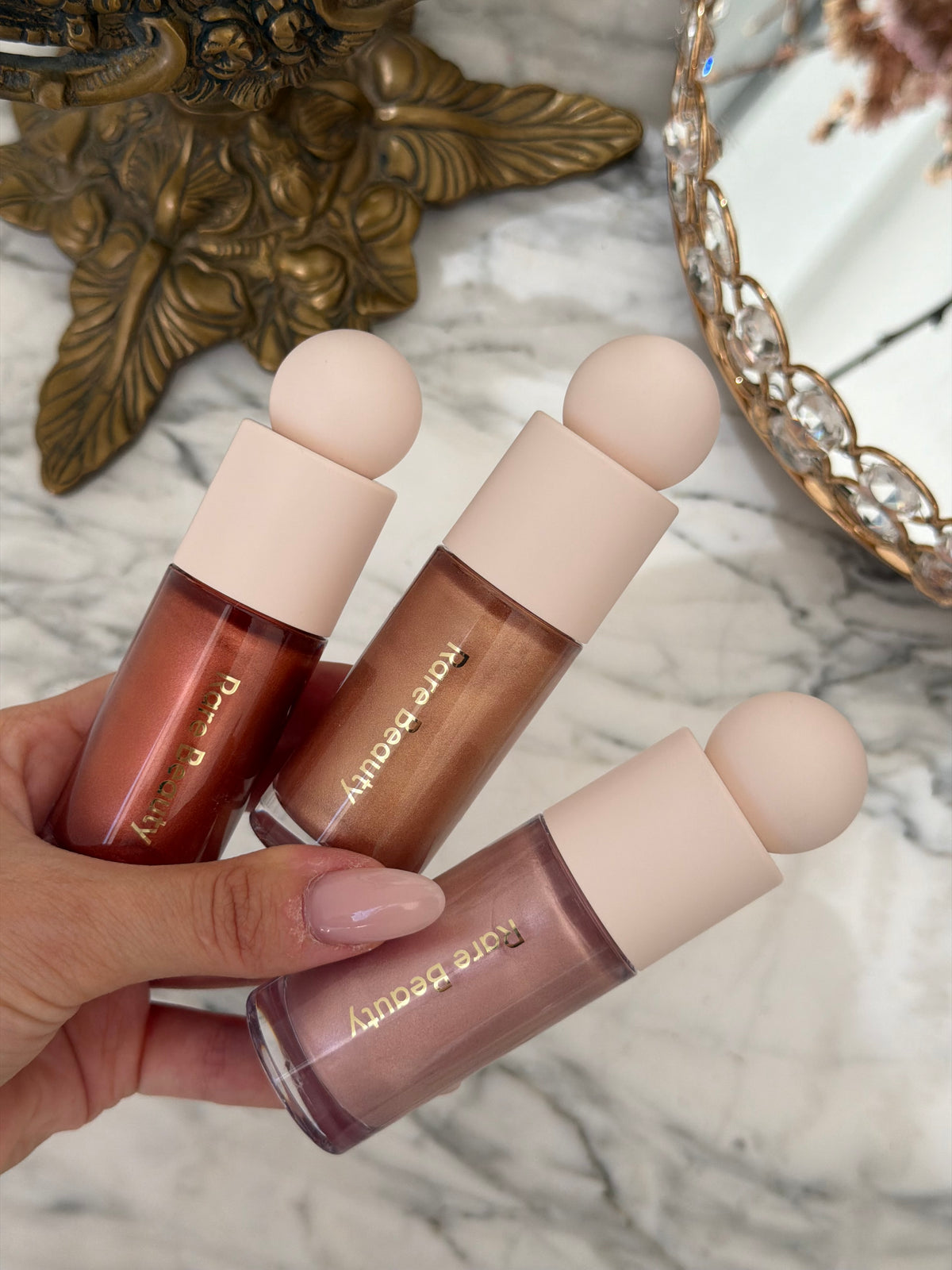 RARE BEAUTY Positive Light Liquid Luminizer - Enchant