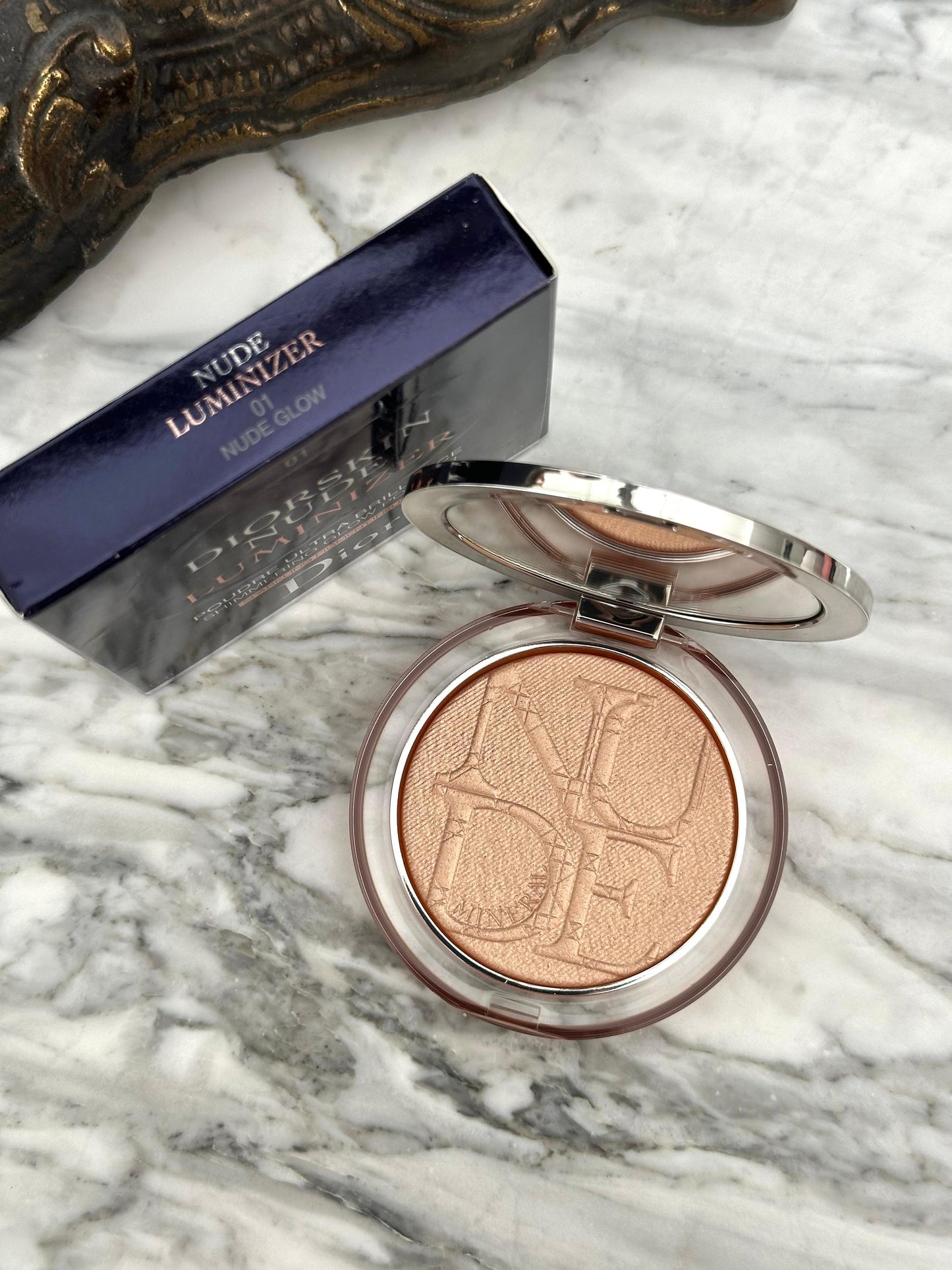 DIOR Diorskin Nude Luminizer
Highlighting Powder - Shimmering Pigments 01