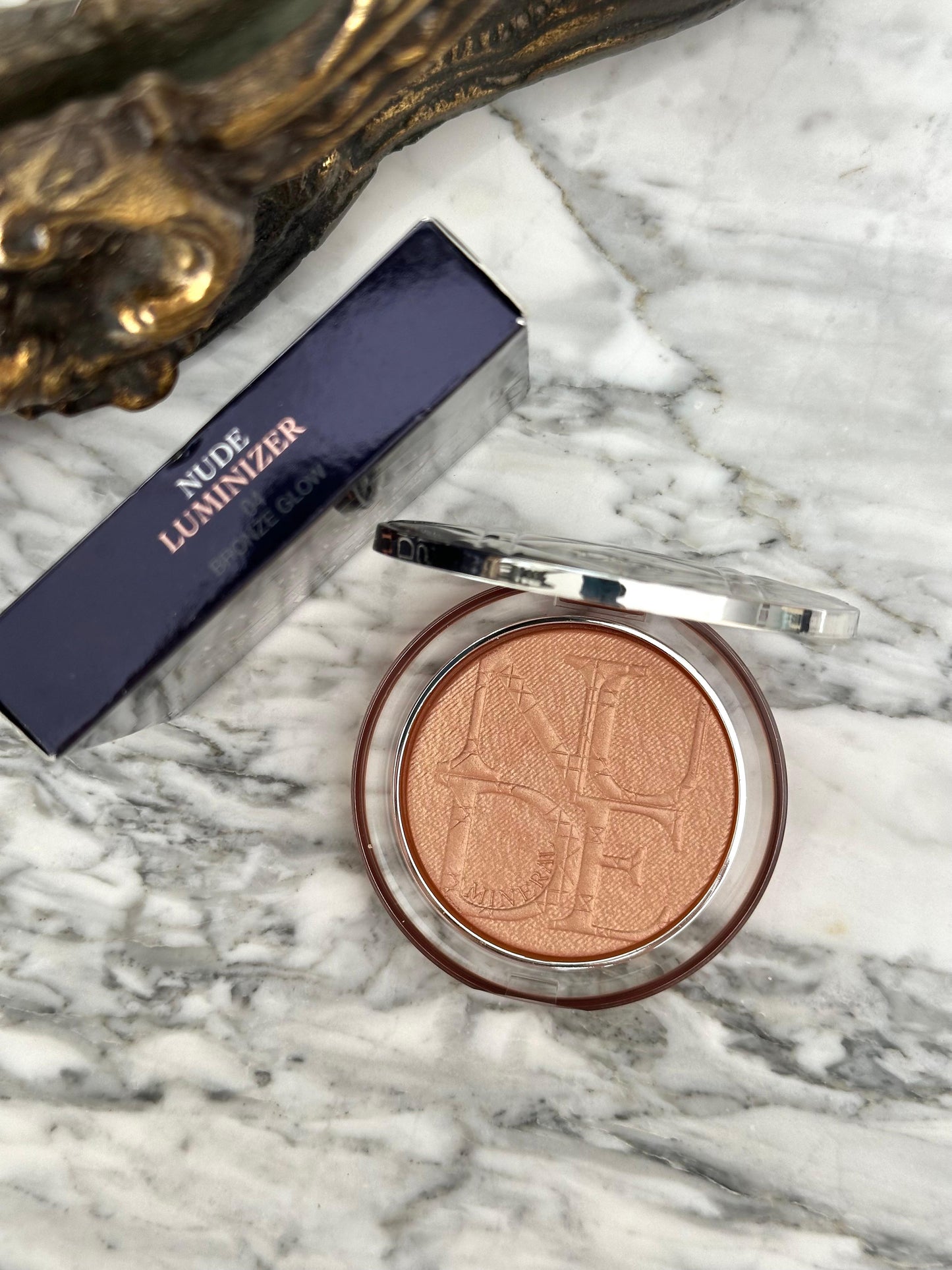 DIOR Diorskin Nude Luminizer
Highlighting Powder - Shimmering Pigments 04