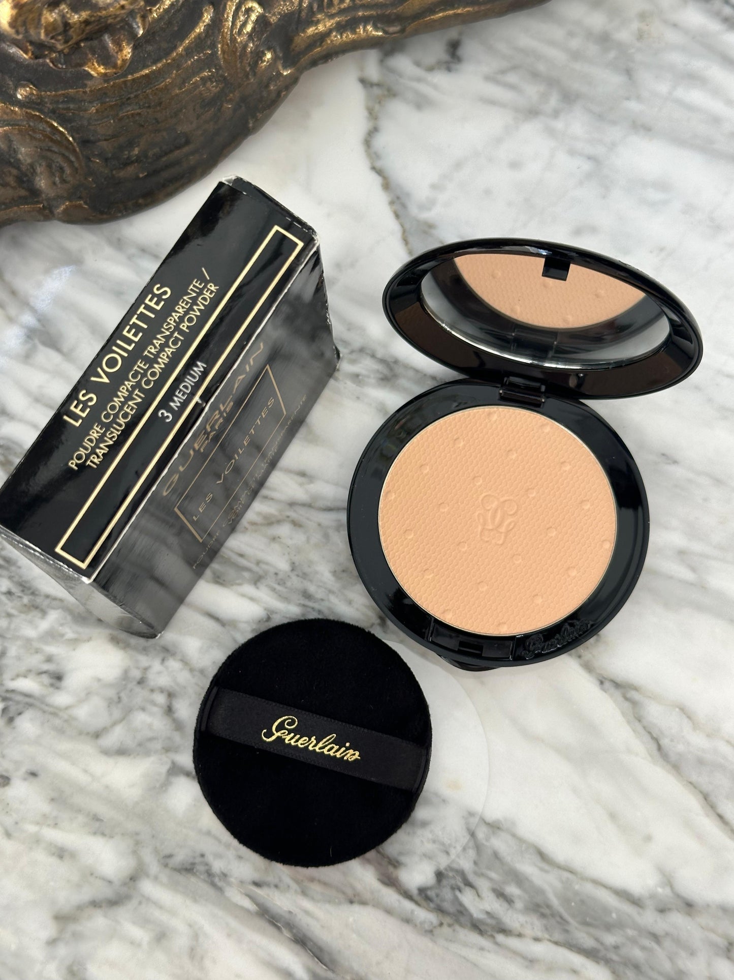 GUERLAIN Les Voilettes
Translucent Compact Powder Mattifying Veil