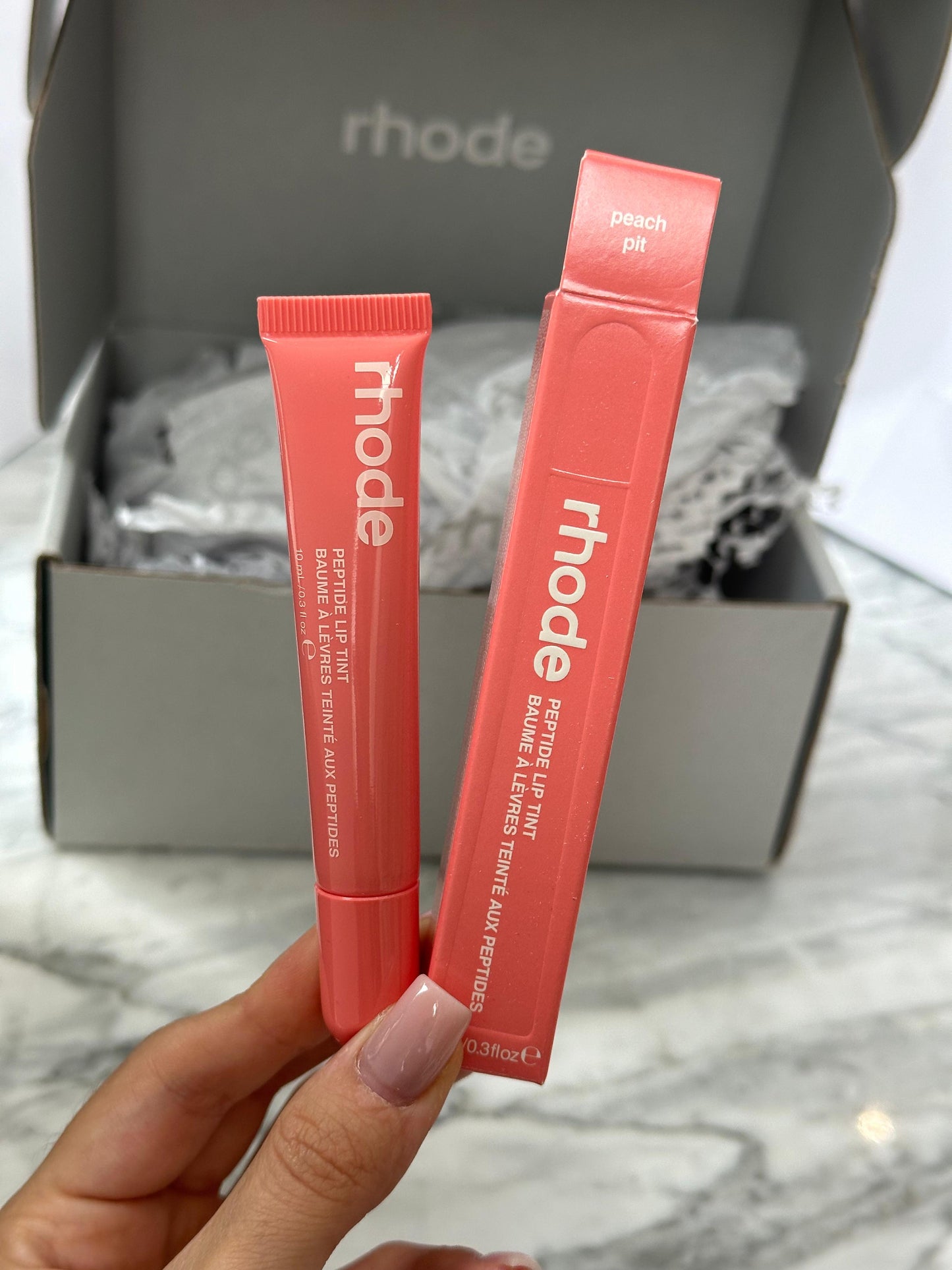 RHODE Peptide Lip Tint
The Tinted Lip Layer - Peach Pit