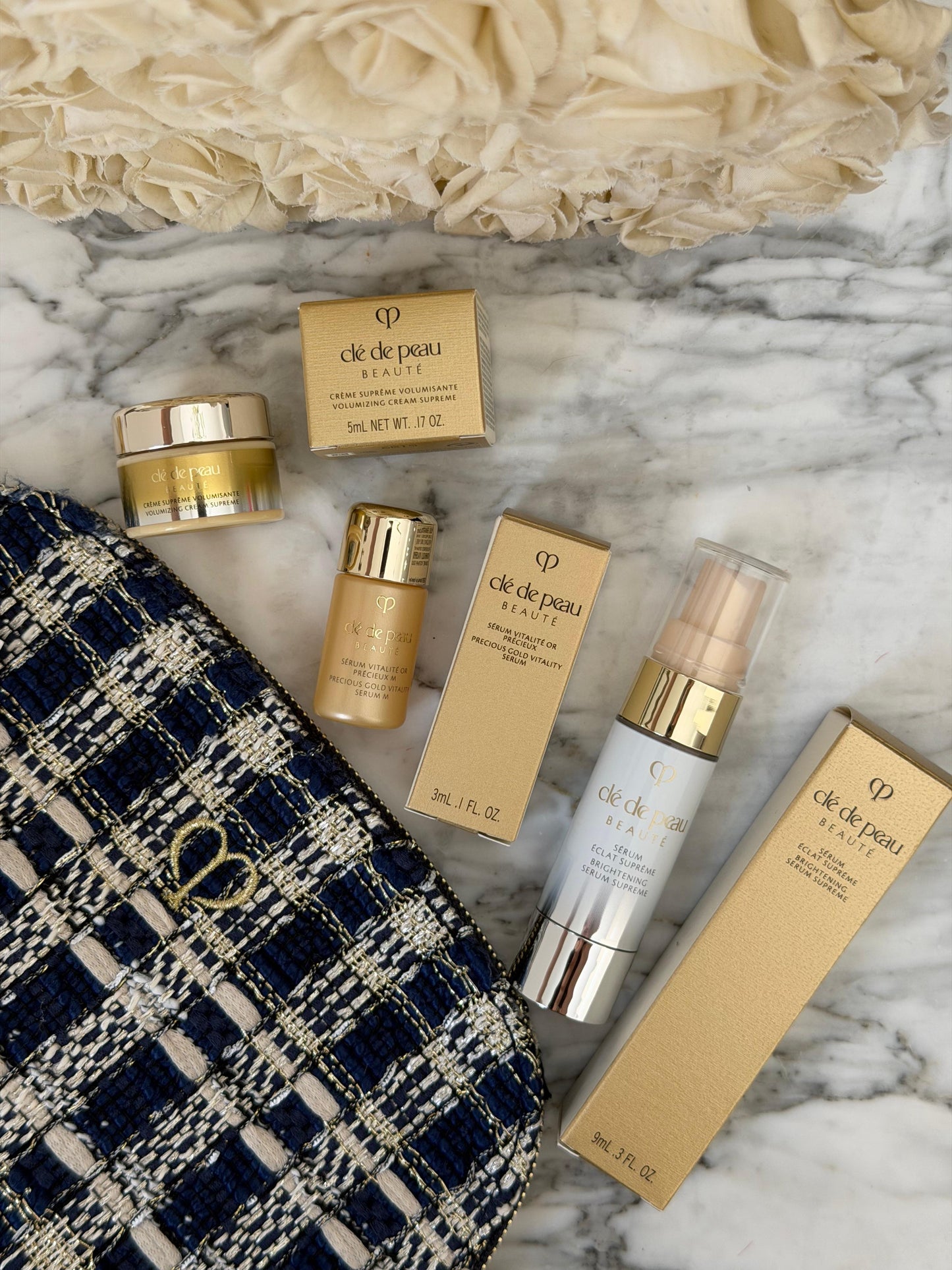 CLE DE PEAU
Beauty Pouch Gift Mini Set (2 Serum + Cream Supreme)
