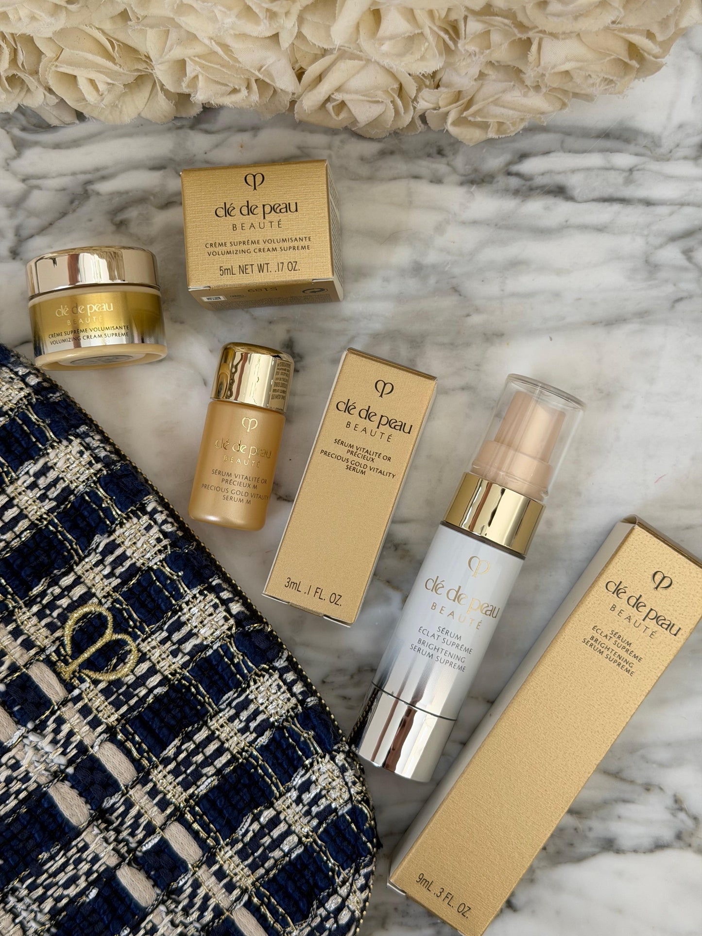 CLE DE PEAU
Beauty Pouch Gift Mini Set (2 Serum + Cream Supreme)