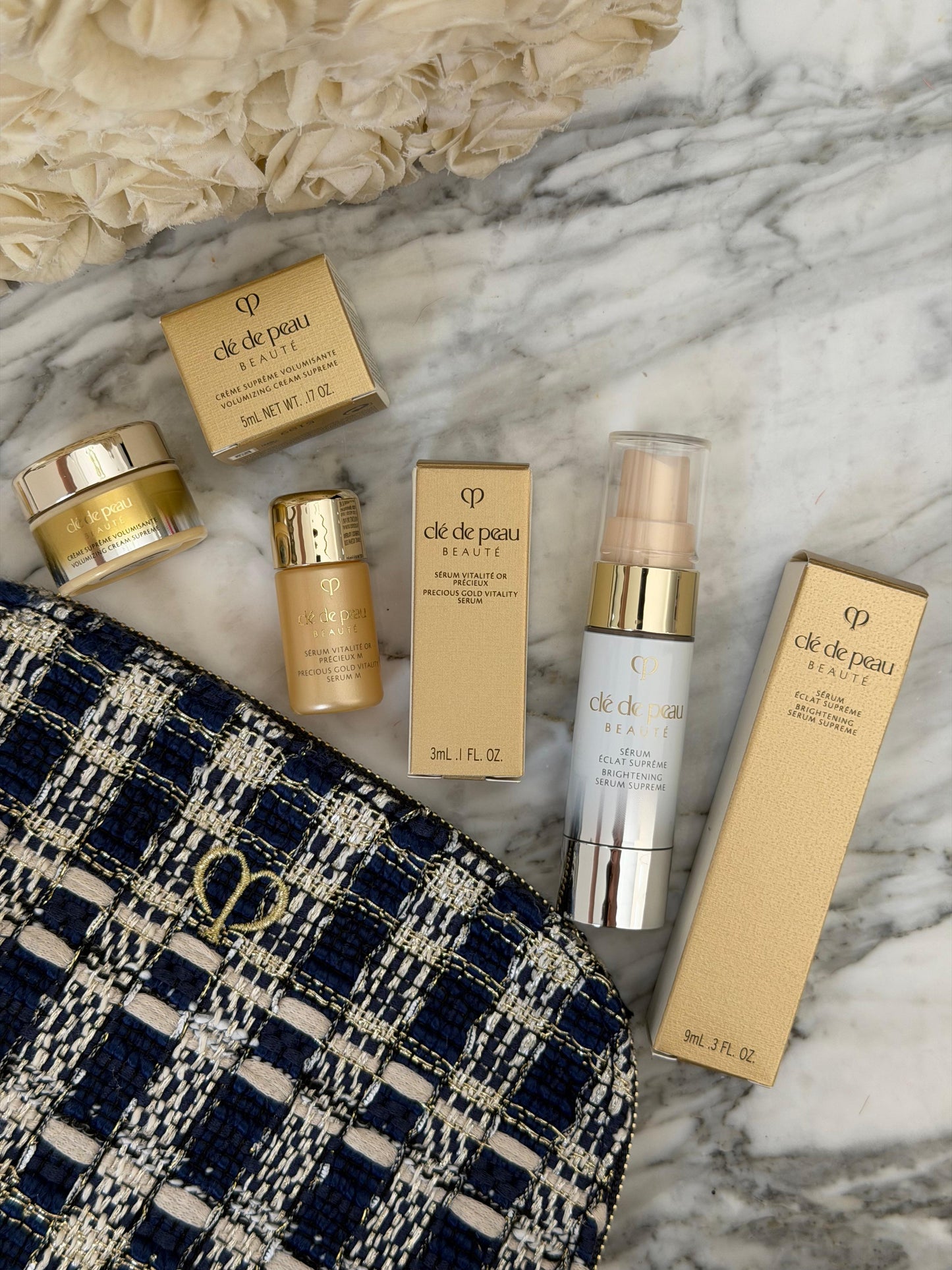 CLE DE PEAU
Beauty Pouch Gift Mini Set (2 Serum + Cream Supreme)