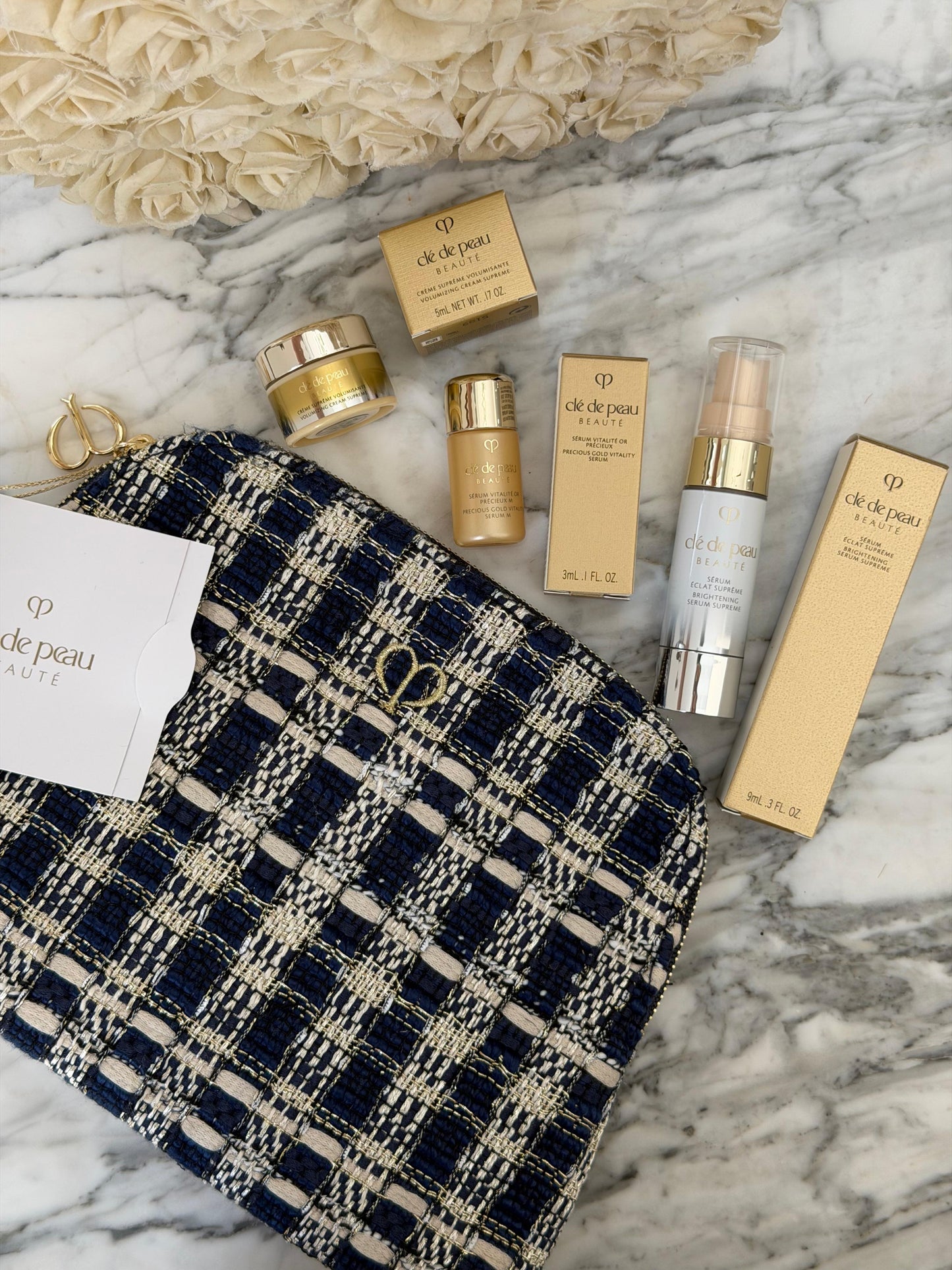 CLE DE PEAU
Beauty Pouch Gift Mini Set (2 Serum + Cream Supreme)