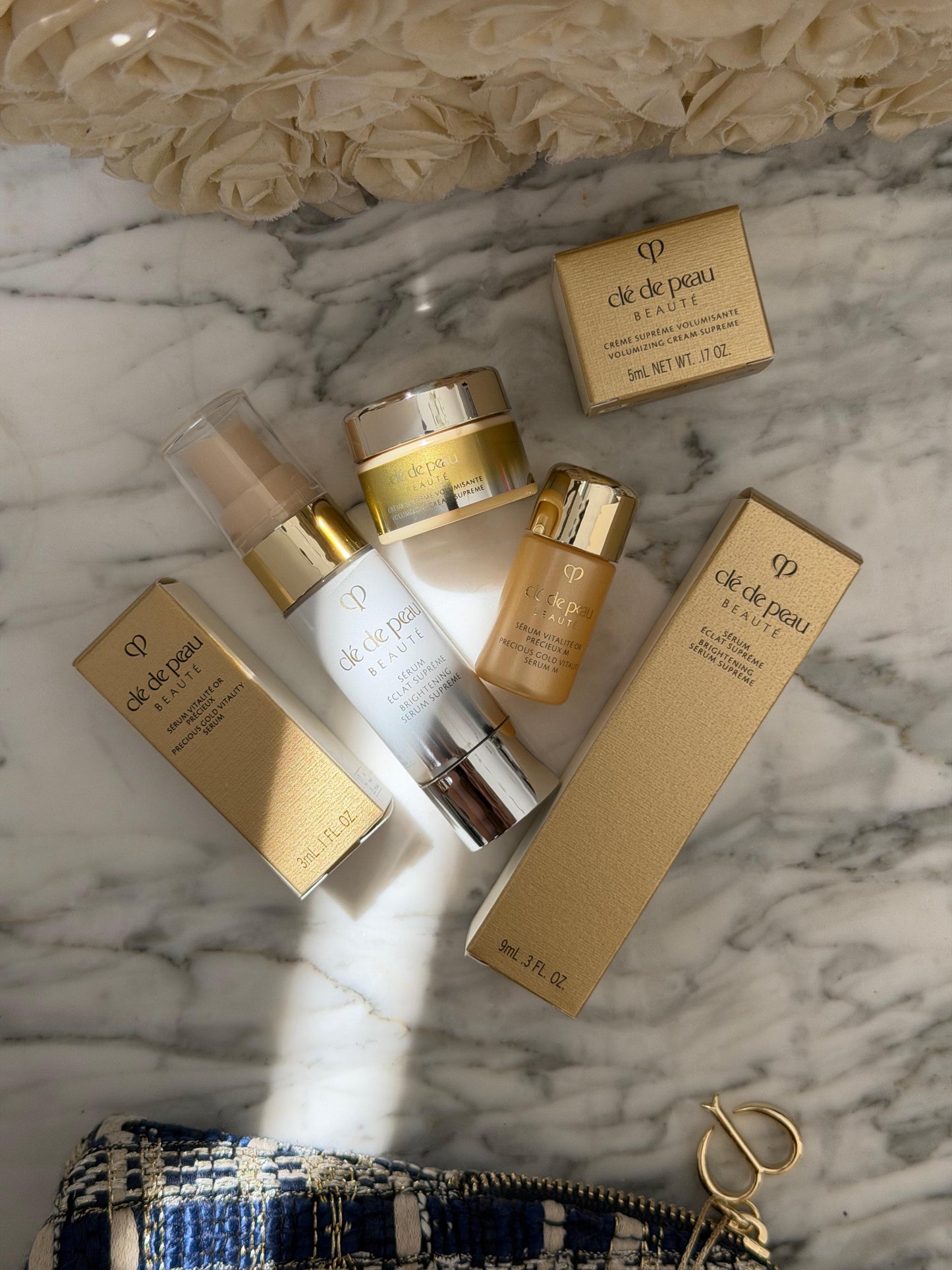 CLE DE PEAU
Beauty Pouch Gift Mini Set (2 Serum + Cream Supreme)