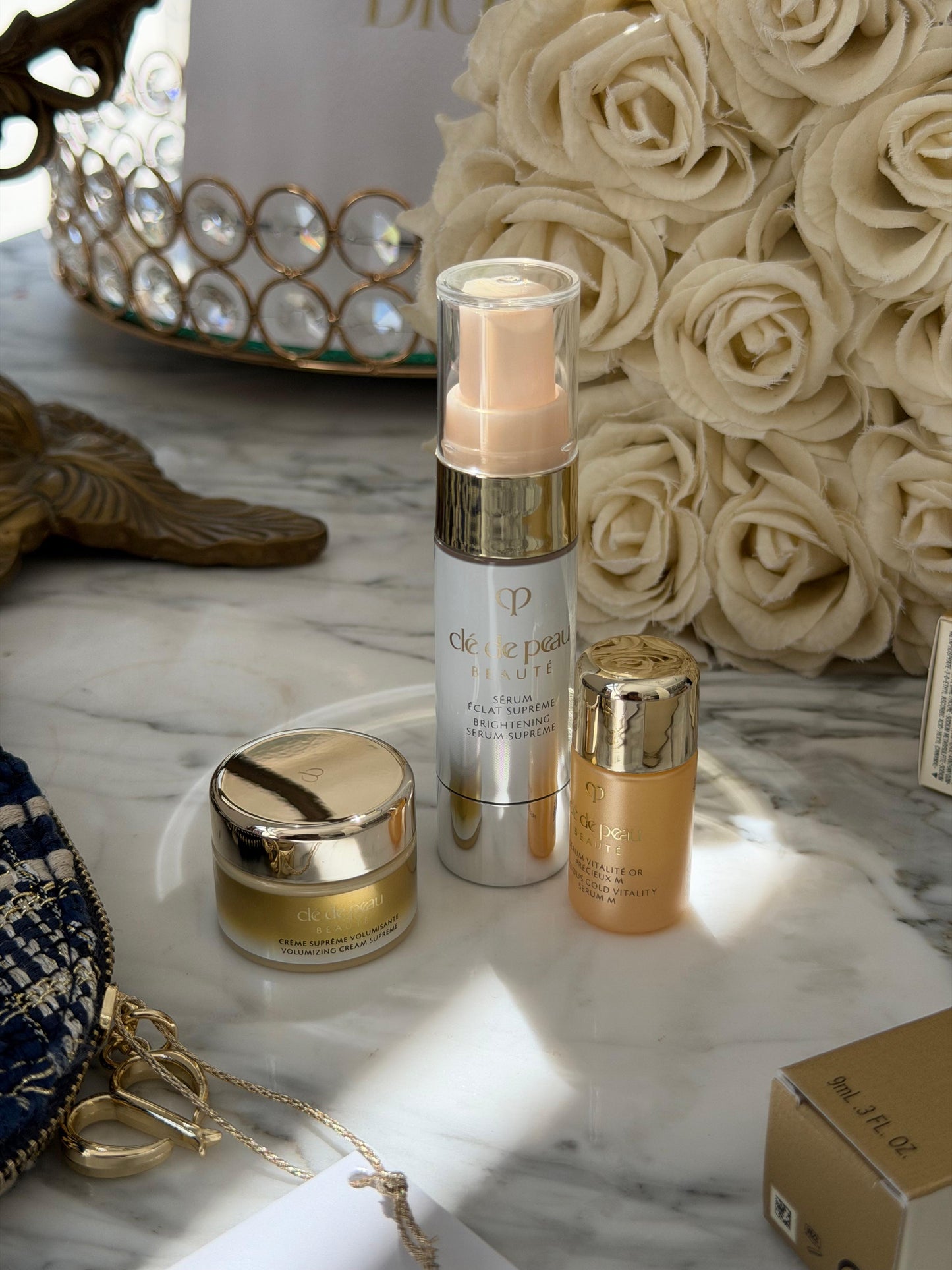 CLE DE PEAU
Beauty Pouch Gift Mini Set (2 Serum + Cream Supreme)