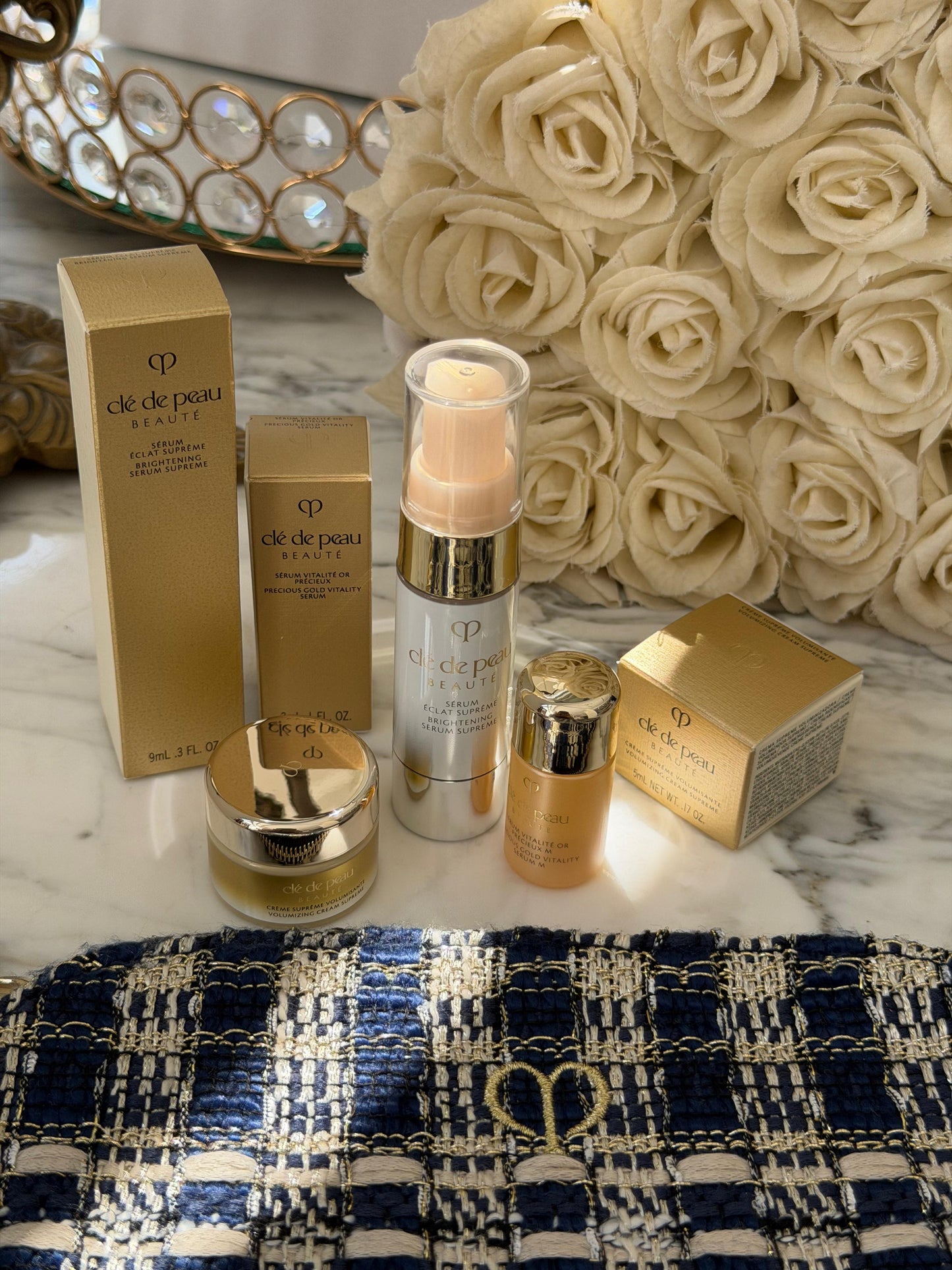 CLE DE PEAU
Beauty Pouch Gift Mini Set (2 Serum + Cream Supreme)