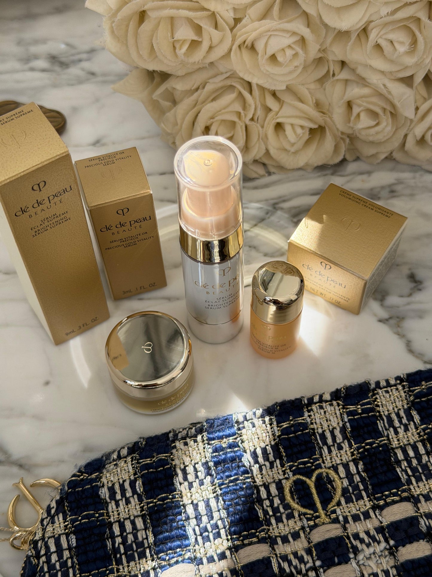 CLE DE PEAU
Beauty Pouch Gift Mini Set (2 Serum + Cream Supreme)