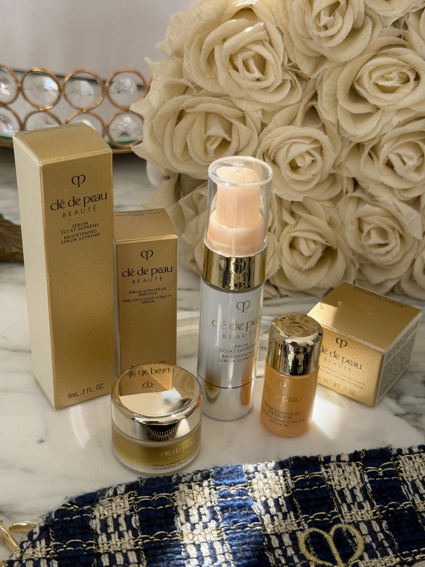 CLE DE PEAU
Beauty Pouch Gift Mini Set (2 Serum + Cream Supreme)