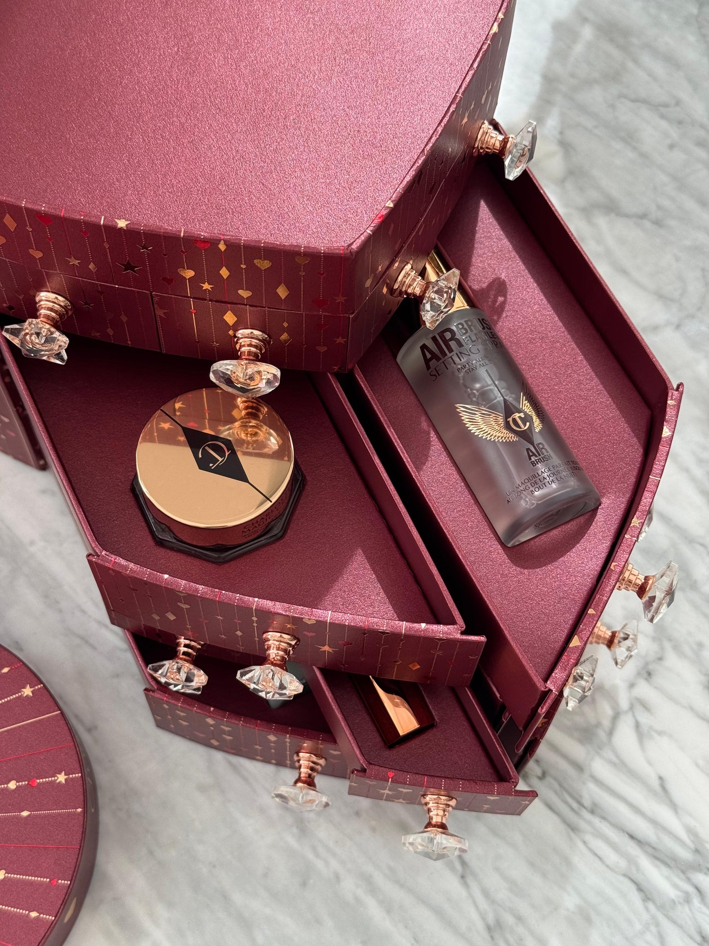 CHARLOTTE TILBURY’S Beauty Treasure Chest Of Love Set
12 Door Beauty Advent Calendar